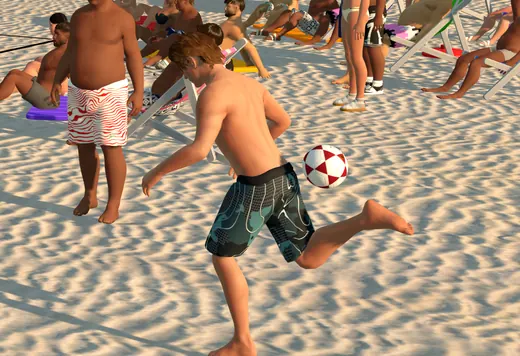 A player kicking the ball backwards in a circle on the sand.